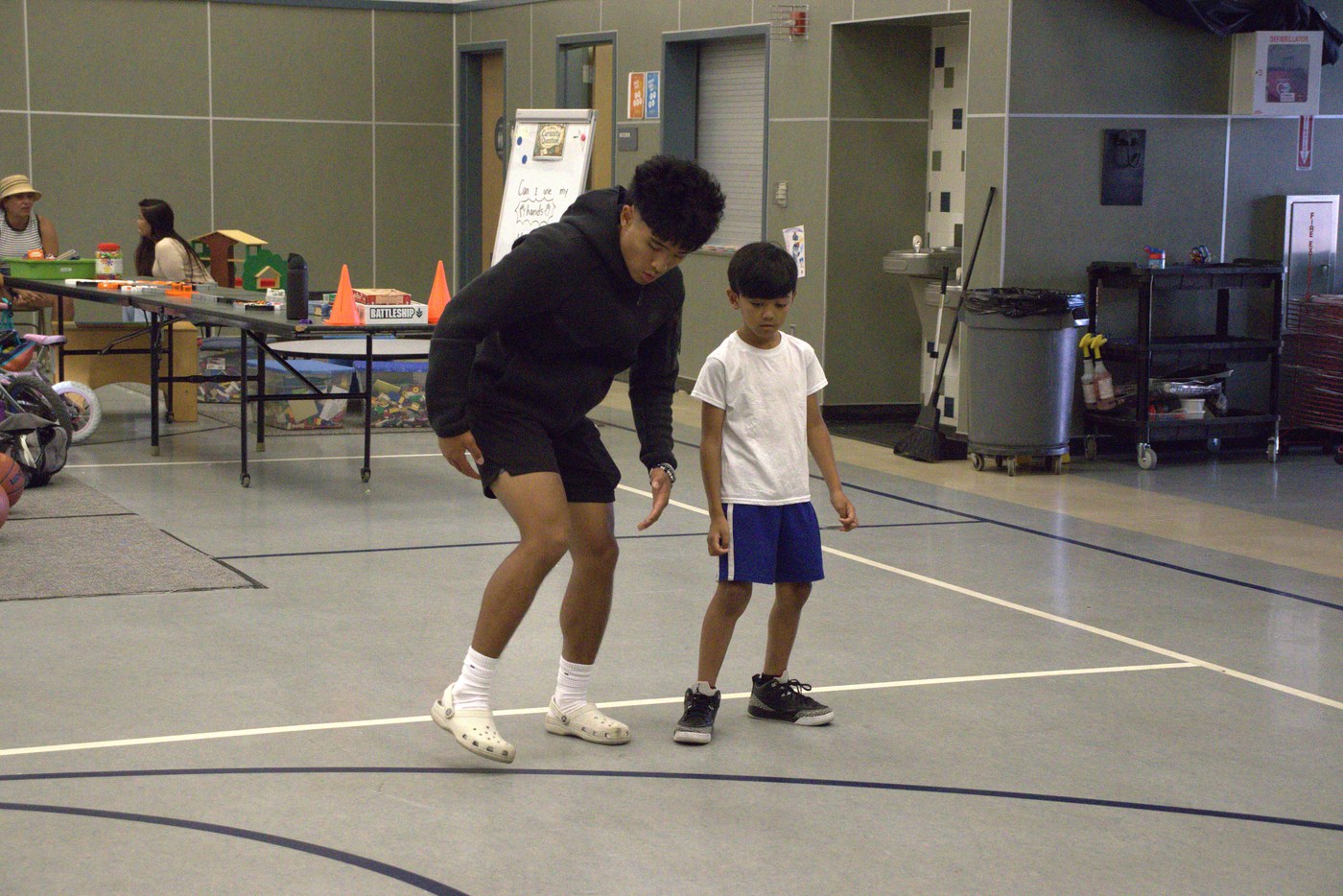 Founding coach working with a young athlete