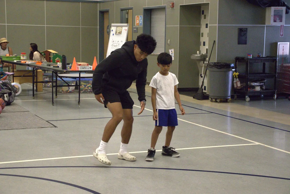 Founding coach working with a young athlete