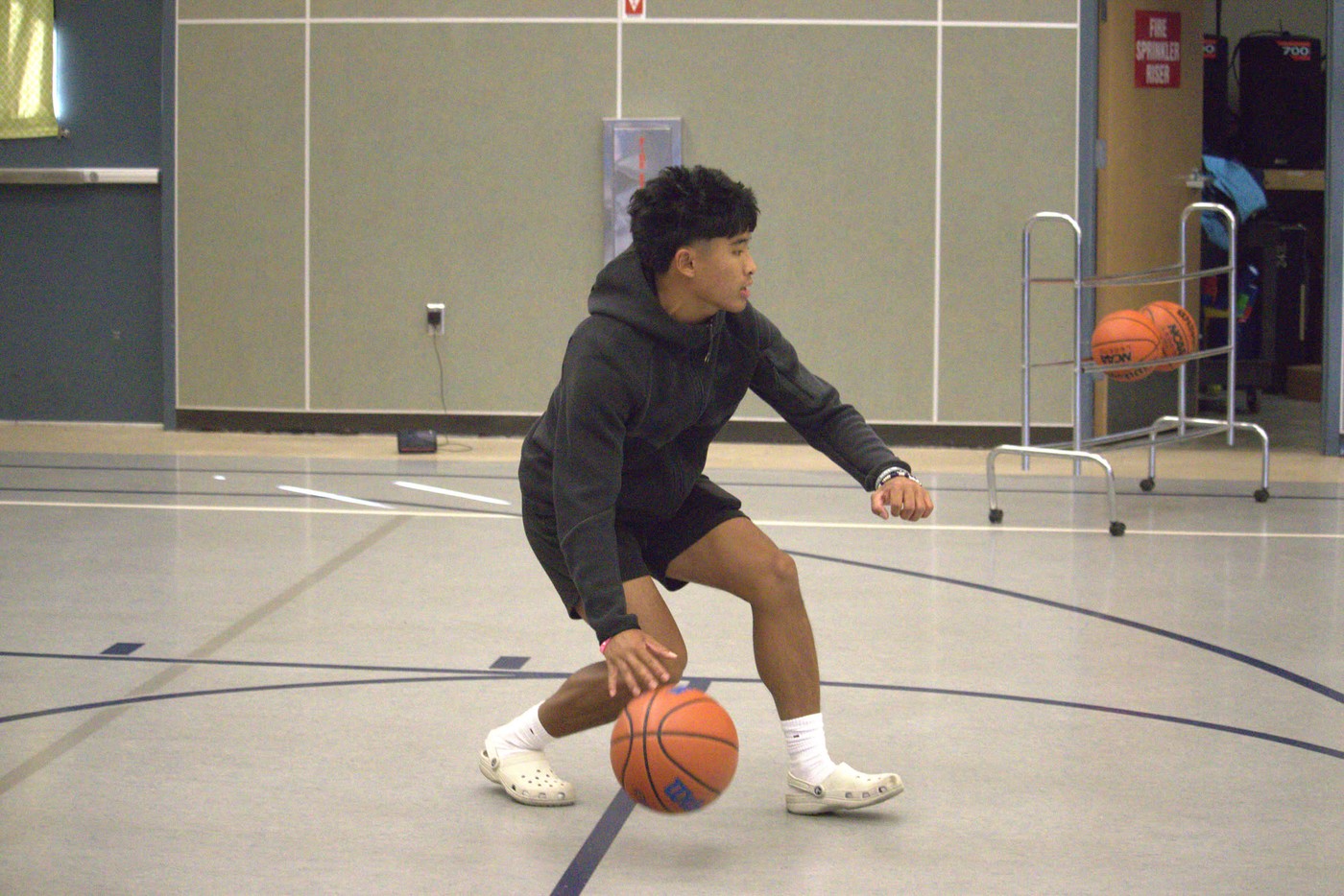 Young athlete working through cone footwork drill